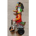 Механическая игрушка Утка на велосипеде винтаж металл