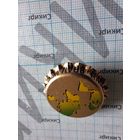 Значок в виде кронен-пробки