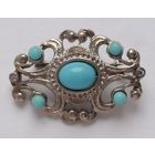 Брошь с голубыми вставками