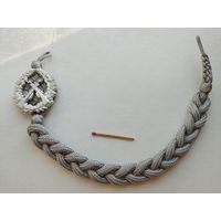 Знак на аксельбанте сотрудника МВД ГДР "За отличную стрельбу"