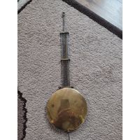 Маятник старинных настенных часов