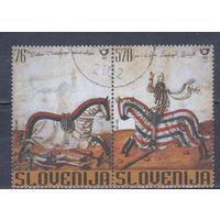 [768] Словения 2003. История.Рыцарский турнир.Лошади на почтовых марках. Гашеная серия в сцепке. Кат.гаш.7 е.