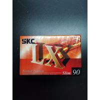 Аудиокассета в упаковке.