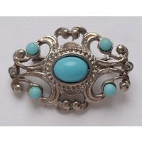 Брошь с голубыми вставками