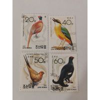 Четыре марки из серии "Орнитолог доктор Вон Хонг Гу. Птицы"